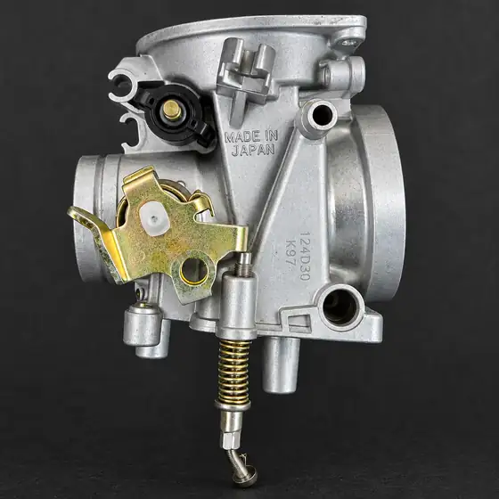Carburettor after cleaning, bare metal and brass fittings